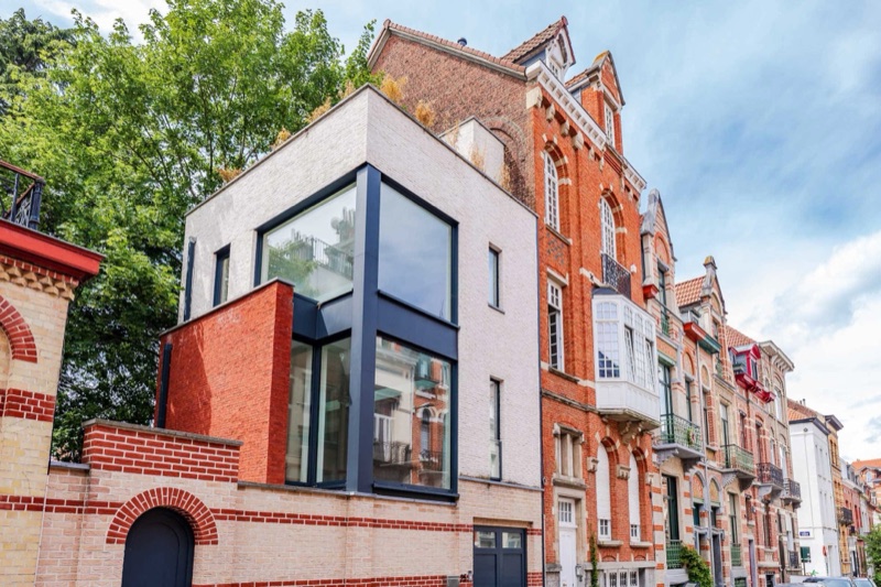 A contemporary glass extension on a classic red-brick townhouse in the European Quarter